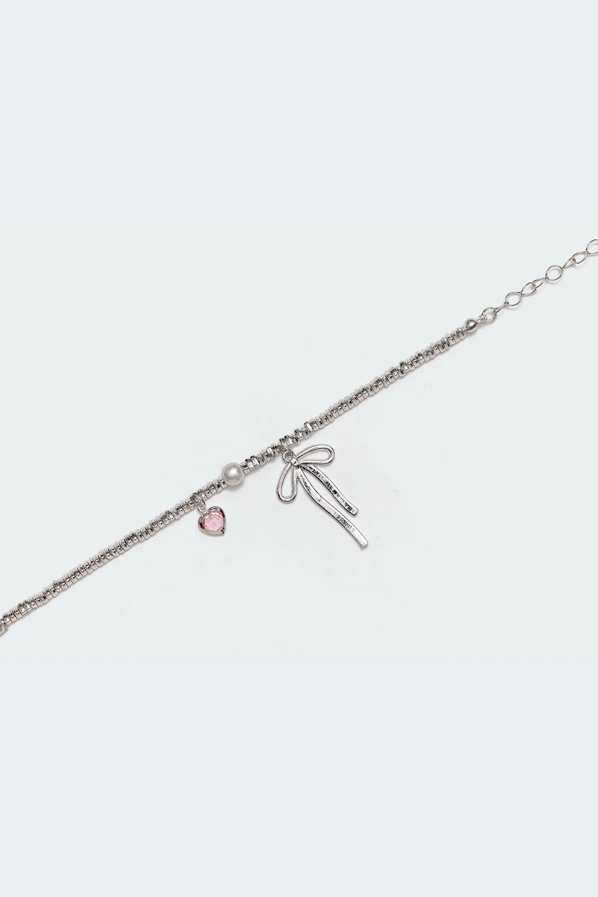 Silver Charm Bracelet with Bow Detail