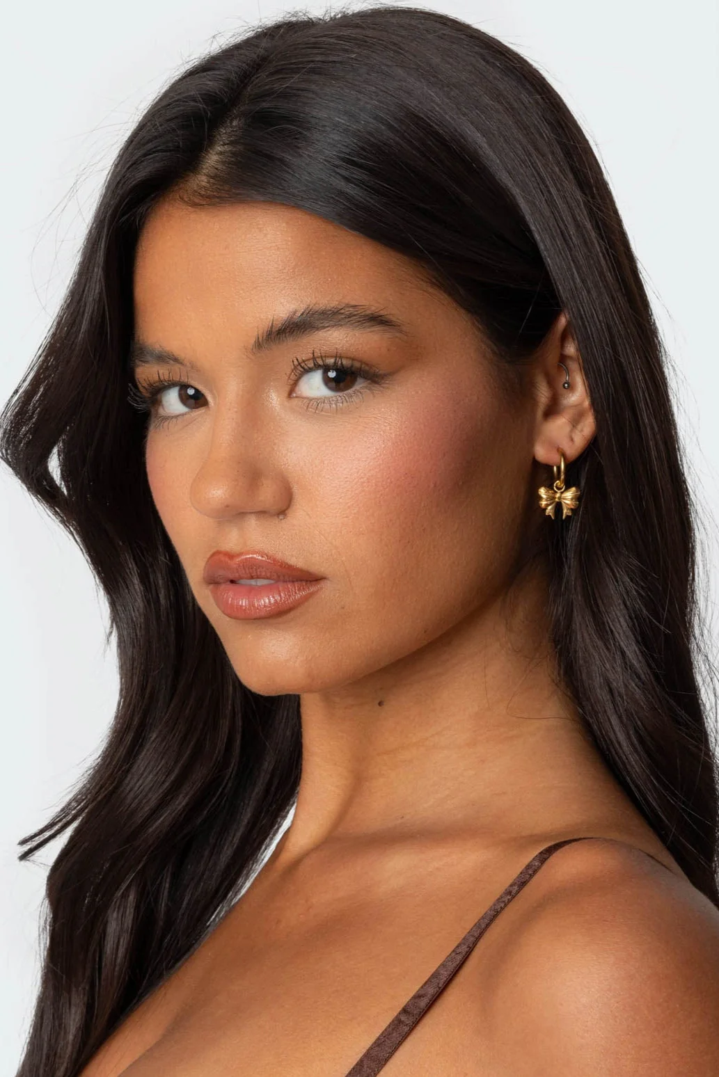 Gold Hoop Earrings with Bow Charm Design