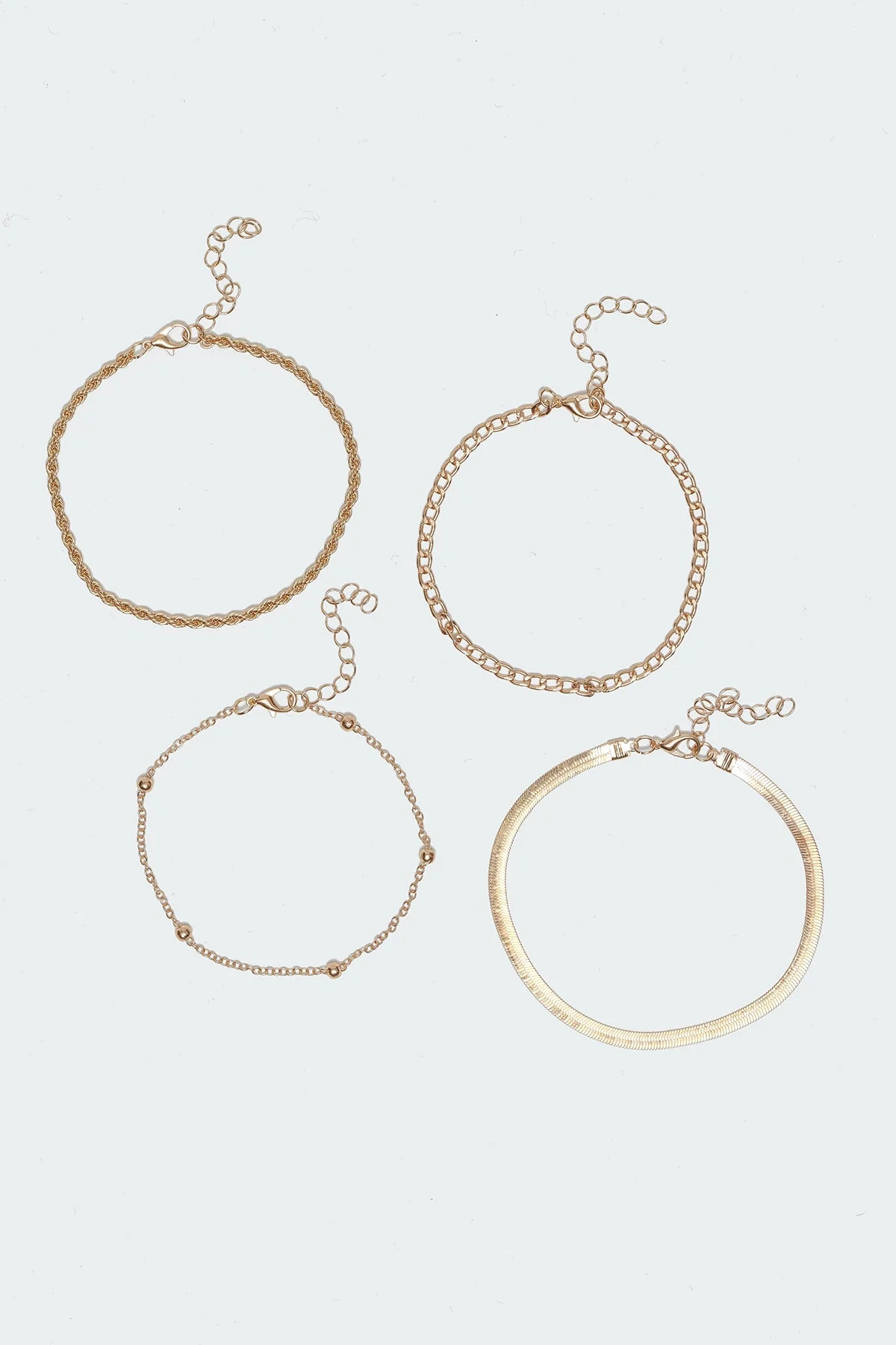 Gold Tone Assorted Anklet Pack - Set of 4 Elegant Chain Designs