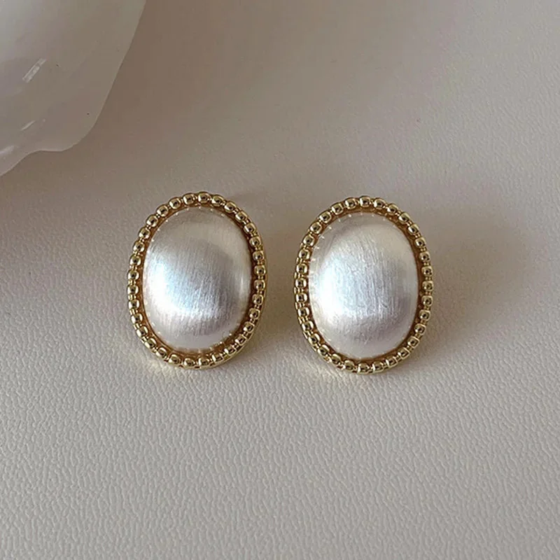 Celestial Dual-Tone Stud Earrings - Balance & Elegance