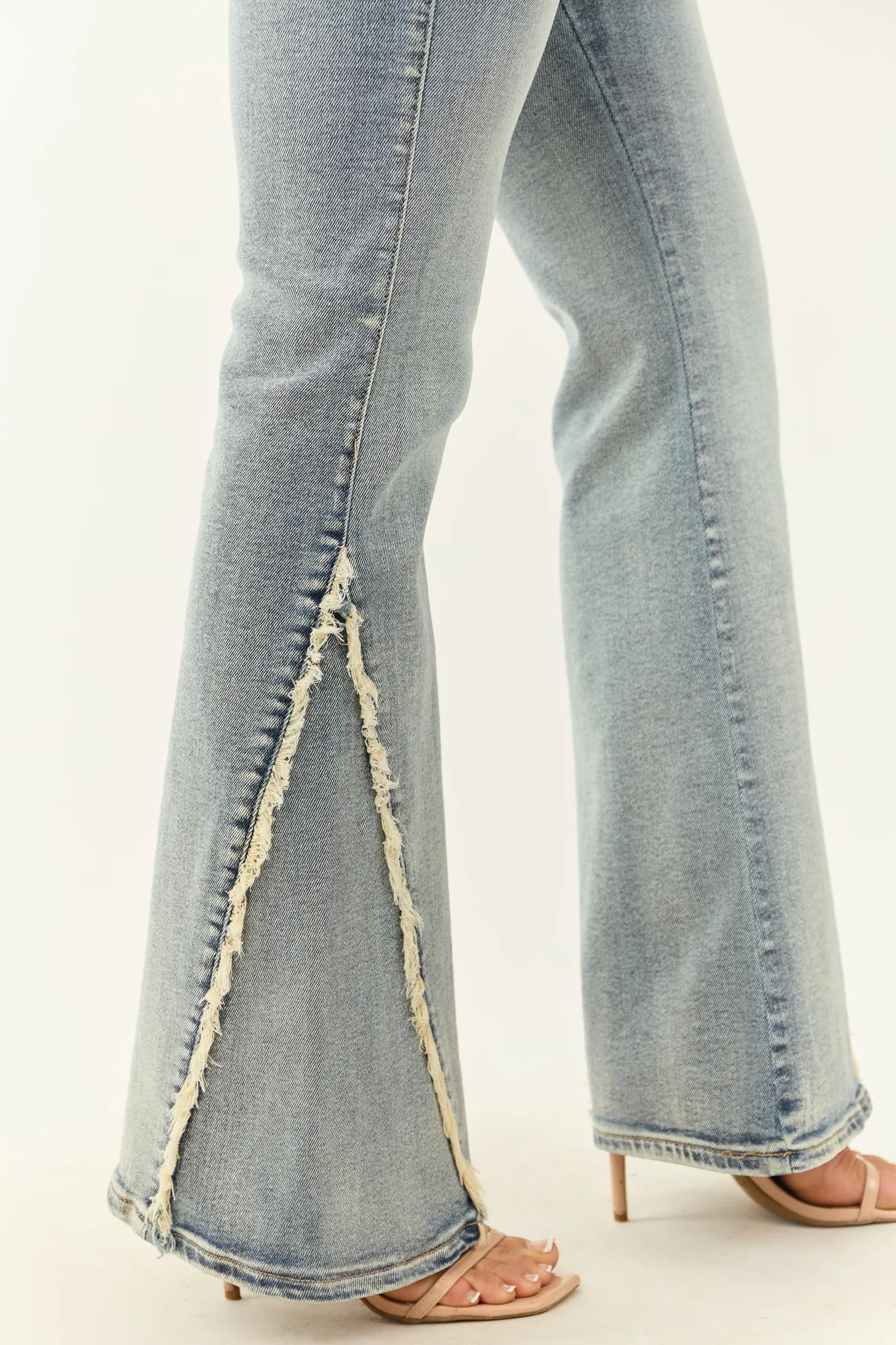Stretchy Frayed Seam Flare Jeans in Medium Wash
