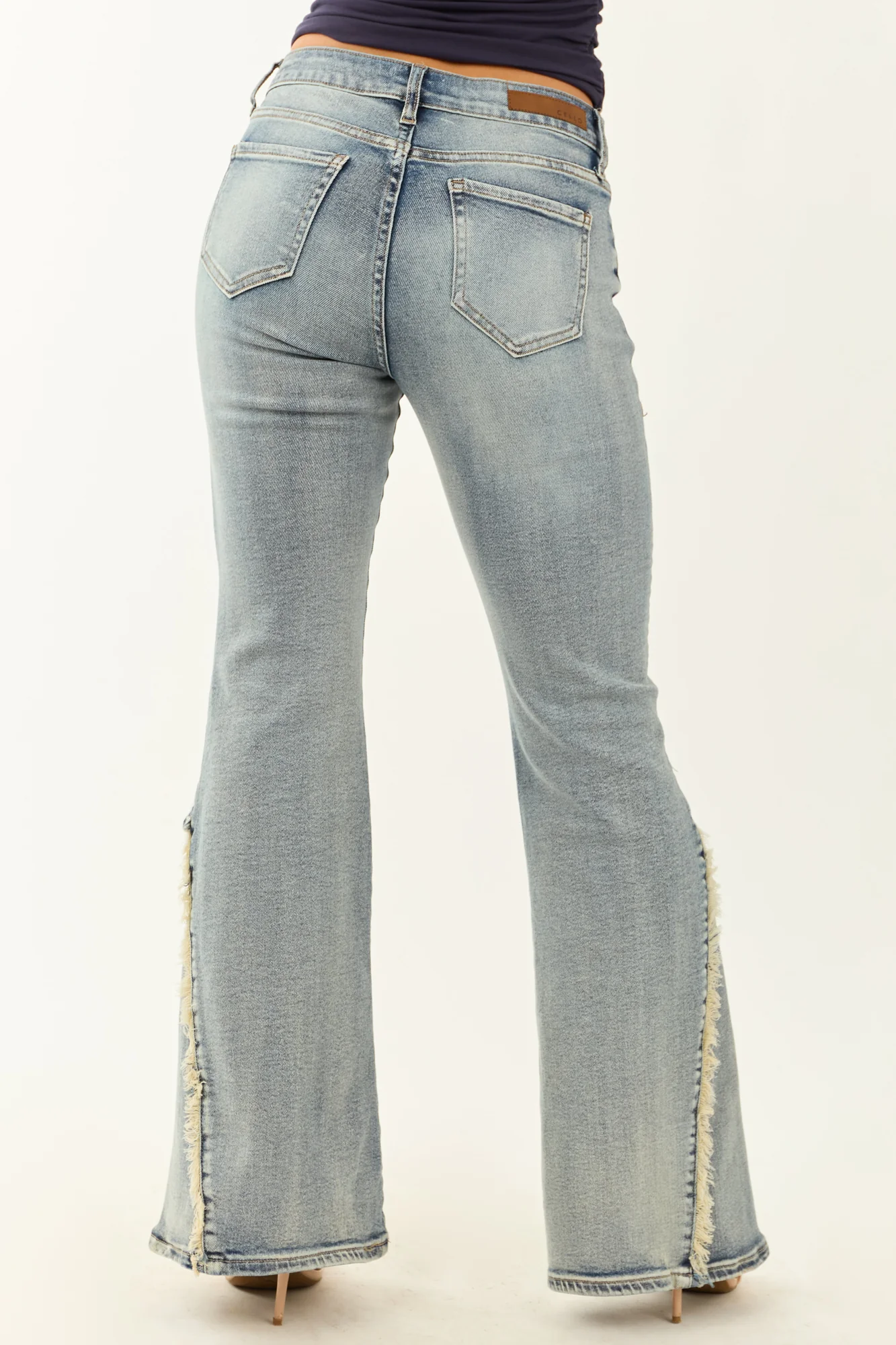 Stretchy Frayed Seam Flare Jeans in Medium Wash